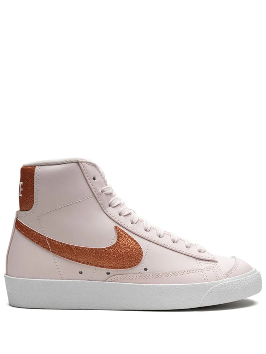 Pink high-top Nike Blazer sneakers with brown swoosh and white rubber sole