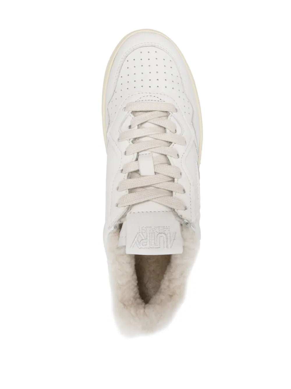 White low-top sneaker opening with lace-up tongue tag and plush faux-fur lining
