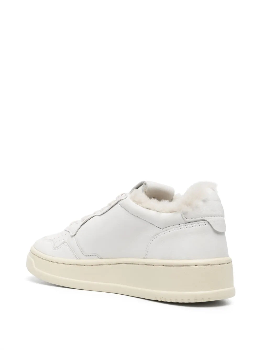 White low-top sneaker with plush faux-fur lining and padded side panels