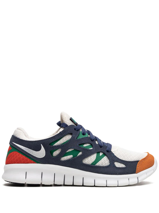 Nike low-top running sneaker, dark blue with white mesh and green, red, orange accents