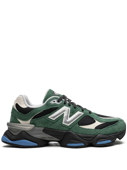 Green low-top lace-up sneakers with white N logo and black/blue chunky sole