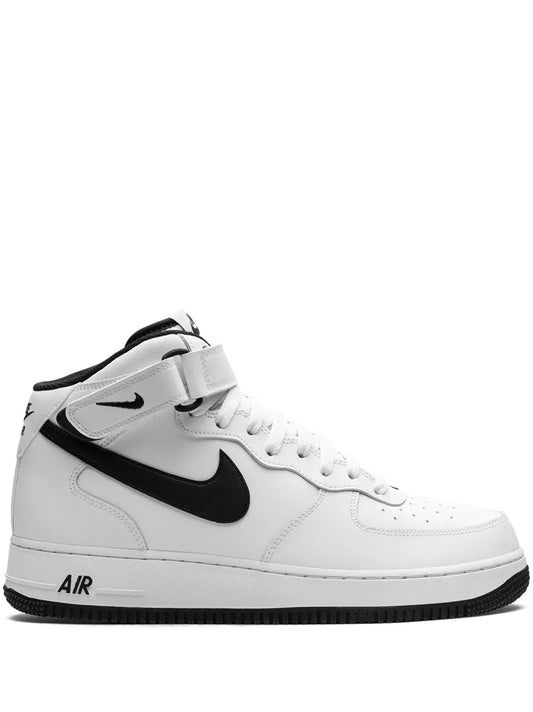 White mid-top Nike sneaker with black Swoosh, lace-up front, padded collar, rubber sole