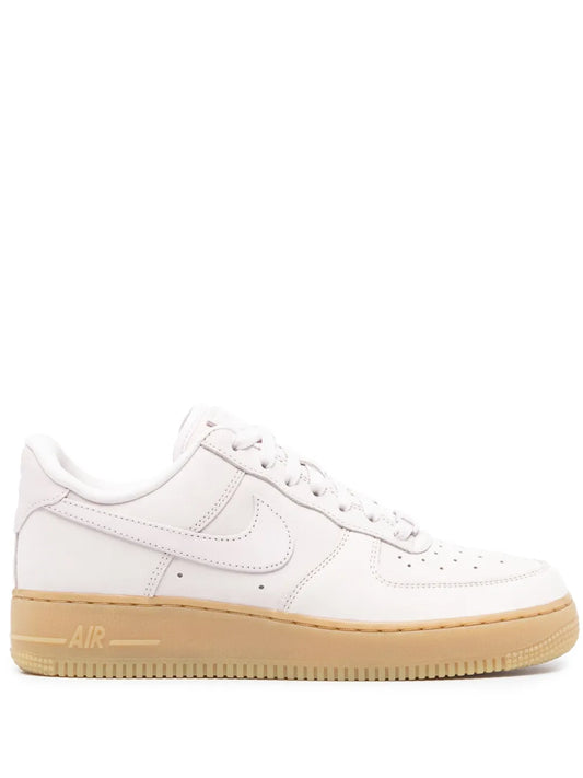 Nike Air Force low-top leather sneaker, white with pink accents and gum sole