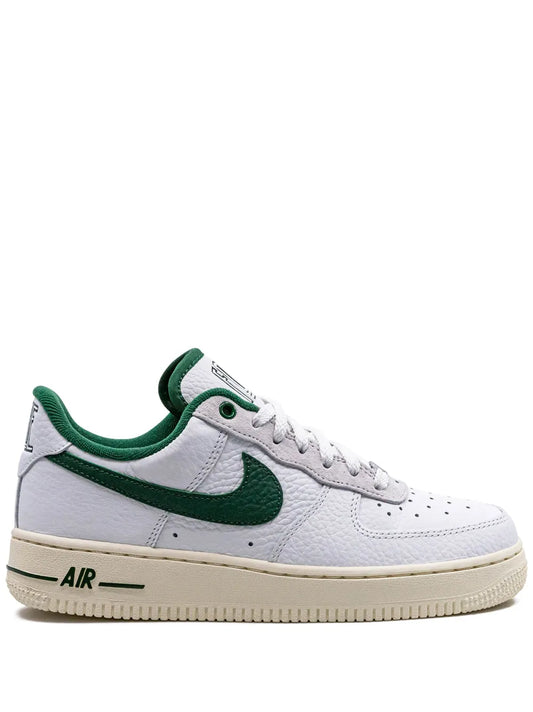 Nike low-top sneakers, white leather with green Swoosh and lace-up, beige gum sole