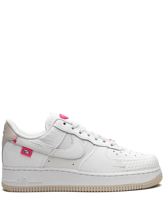 Nike Air Force 1 '07 Lx low-top sneakers in white with pink accents and tan outsole