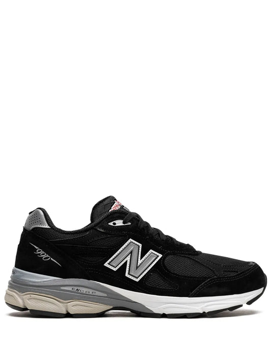 Black low-top New Balance sneaker with N logo, lace-up design, cushioned sole