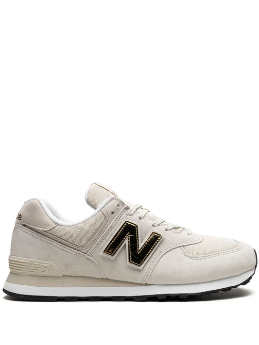 New Balance 574 light grey low-top sneaker with bold N logo