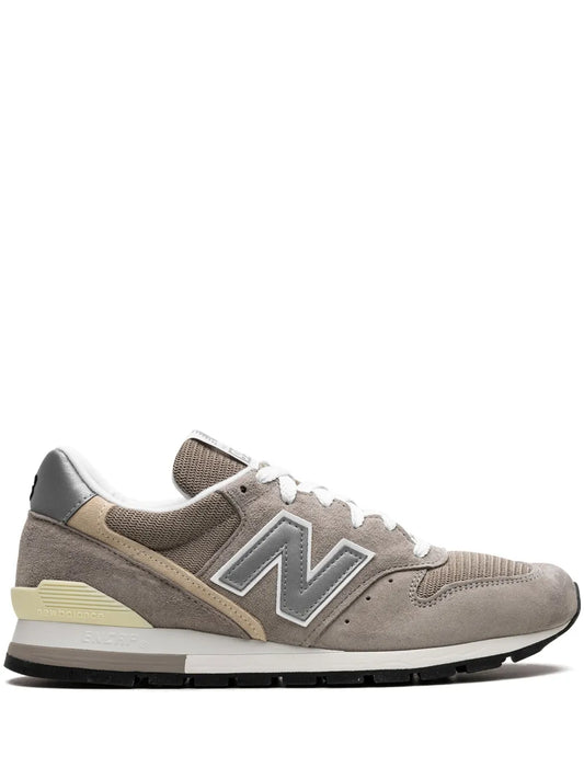 Grey New Balance 996 sneakers with white laces and black rubber outsole