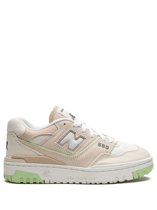 Beige New Balance 550 sneakers with green outsole and side logo