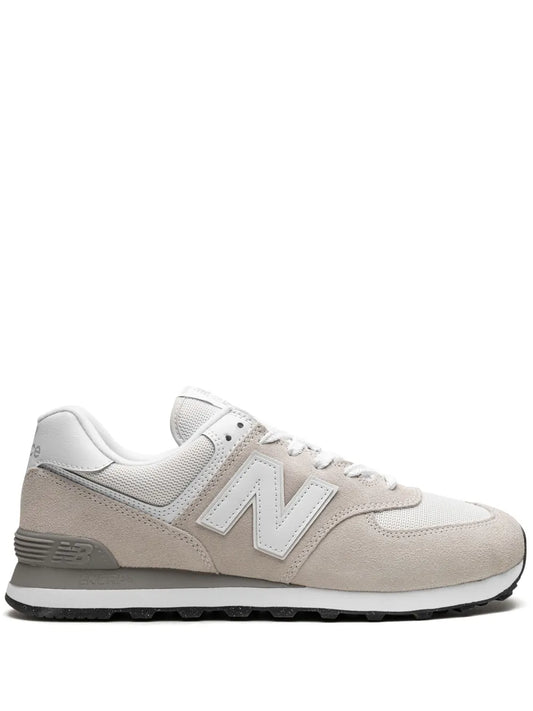White and beige New Balance low-top sneaker with "N" logo and lace-up design