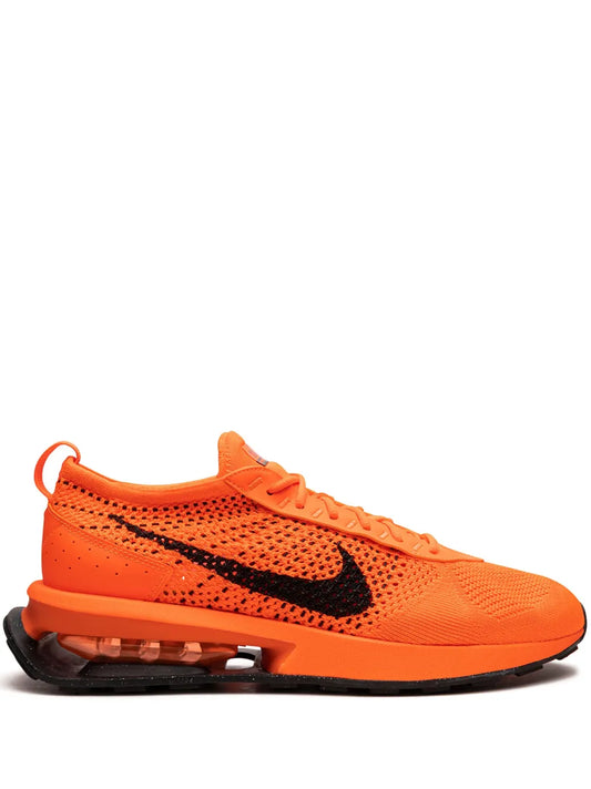 Nike Air Max Flyknit Racer orange knit sneaker with black swoosh and Air Max sole