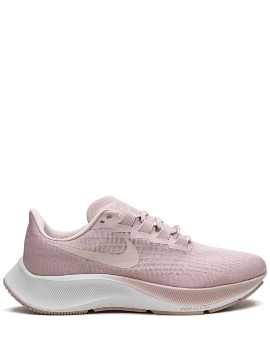 Pink Nike Air Zoom Pegasus running shoes with lace-up front and white swoosh