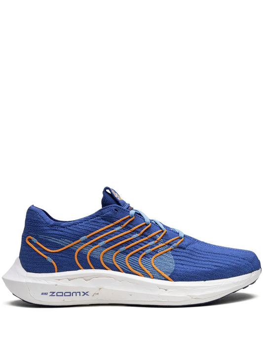 Nike Pegasus Turbo blue running shoe with orange stripe laces and white midsole