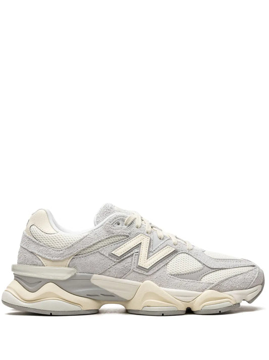 New Balance 9060 sneakers in light gray with cream sole, side N logo