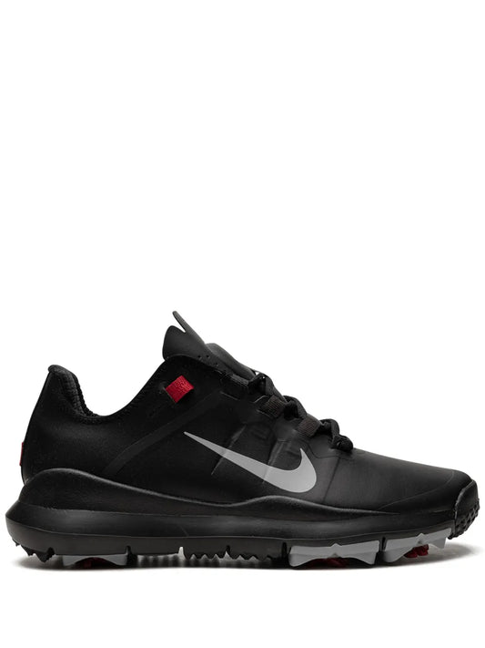 Nike golf shoes in black with red accents, lace-up, rubber traction sole