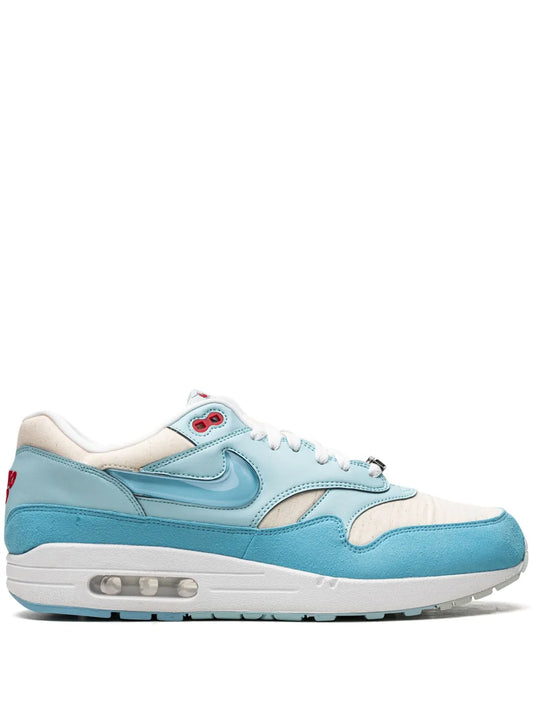 Light blue and white Nike Air Max 1 sneakers with visible Air unit