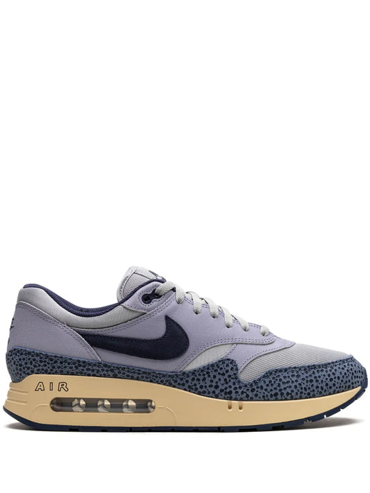 Grey Nike Air Max 1 sneakers, dark swoosh and tan midsole with Air window