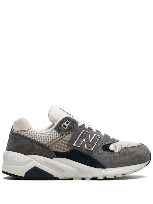 Grey New Balance 580 running sneaker with navy suede panels and N logo