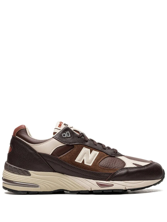 Brown New Balance 991 low-top sneaker with 'N' side logo and lace-up closure