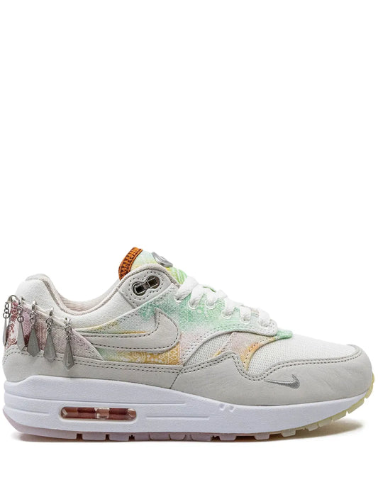 Nike Air Max 1 '87 sneakers in white with light gray and pastel accents, side view