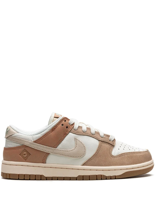 Nike Dunk Low SE sneakers in white, tan and brown; lace-up with Swoosh and panel stitching