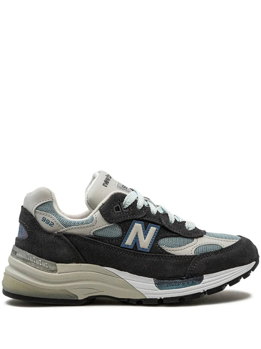 Grey and black lace-up running sneakers with blue N logo