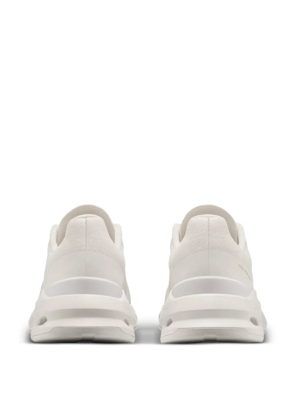 On Cloudpulse white sneakers, rear view with lace-up upper and cushioned heel