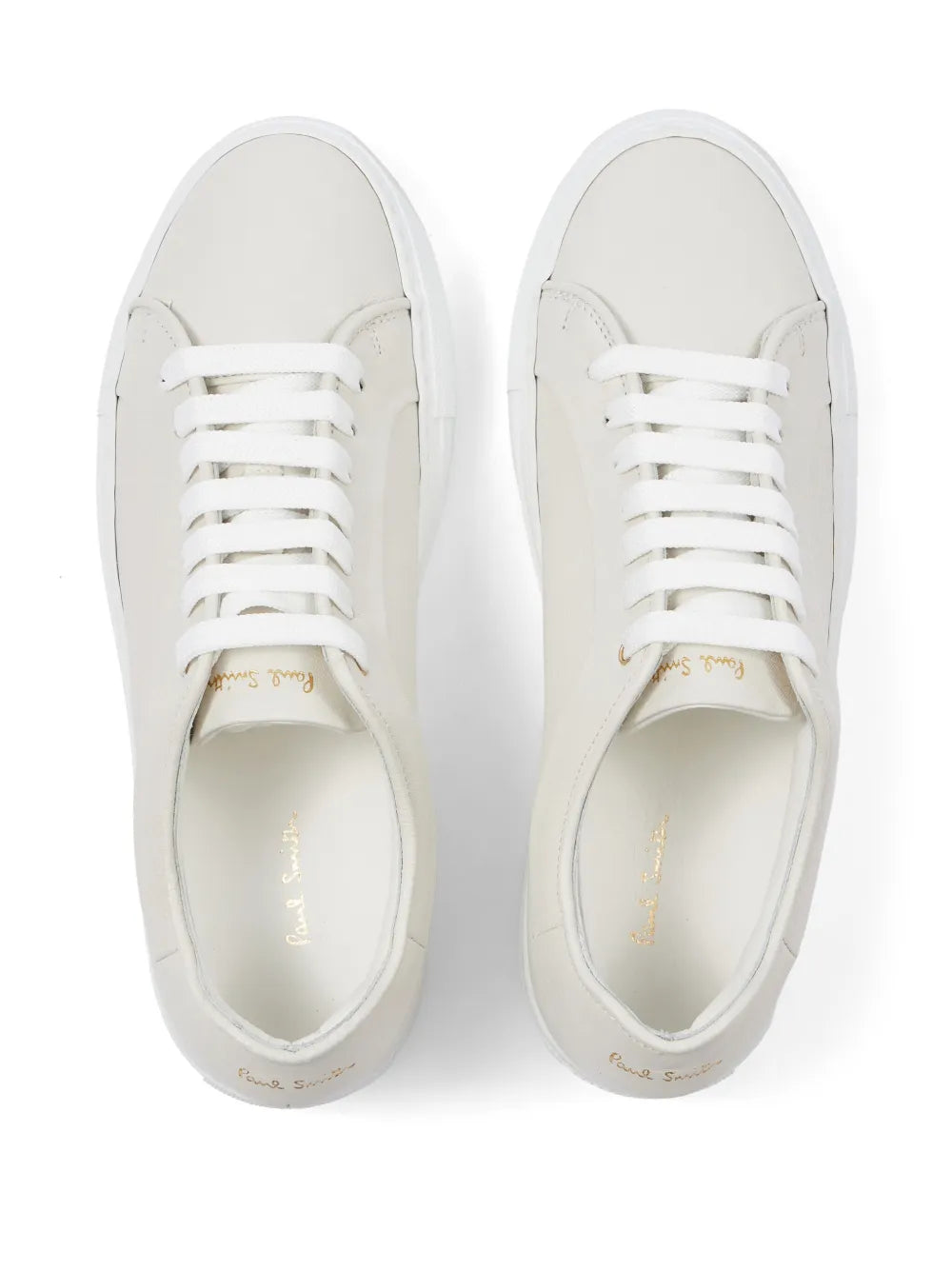 Pair of white low-top sneakers showing laces and stitched toe caps
