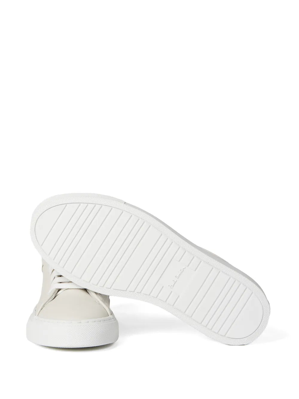 White low-top sneaker outsole with rubber tread visible