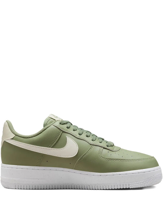 Green low-top lace-up sneakers with white Swoosh and white sole