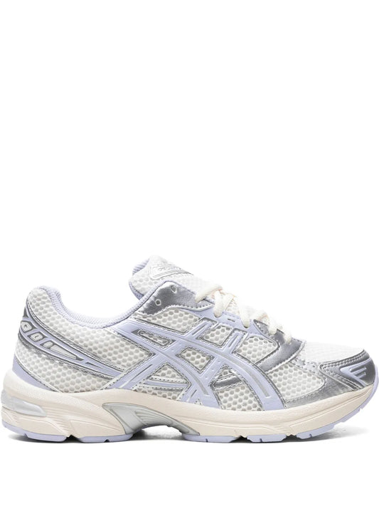 ASICS Gel-1130 running sneaker in white with light blue accents, mesh and suede overlays.