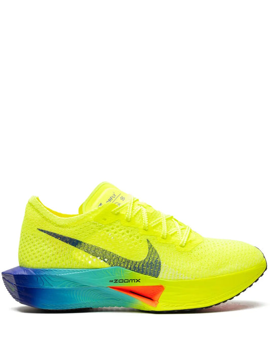Neon yellow running shoes with Nike swoosh and blue teal ZoomX midsole
