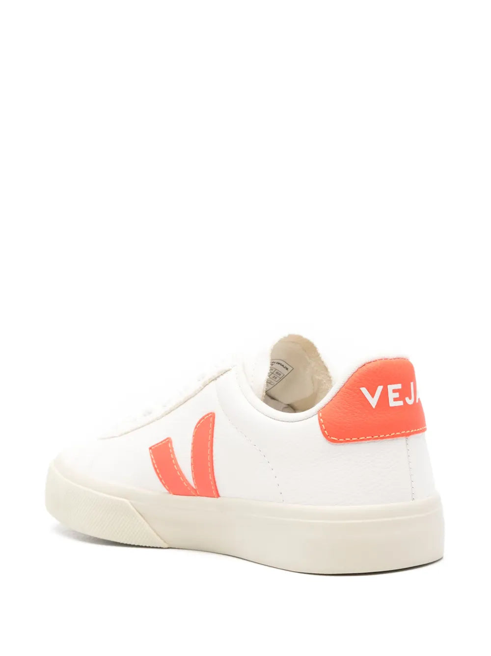 White low-top sneakers with orange heel tab and rear VEJA logo