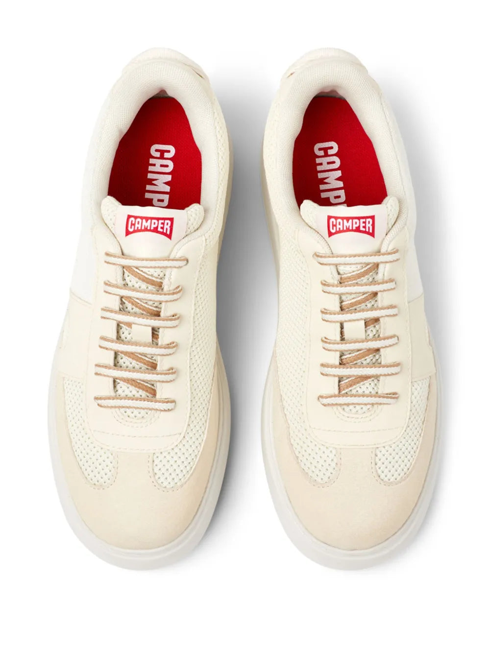 White sneaker showing Camper logo on tongue and heel tabs, lace-up eyelets