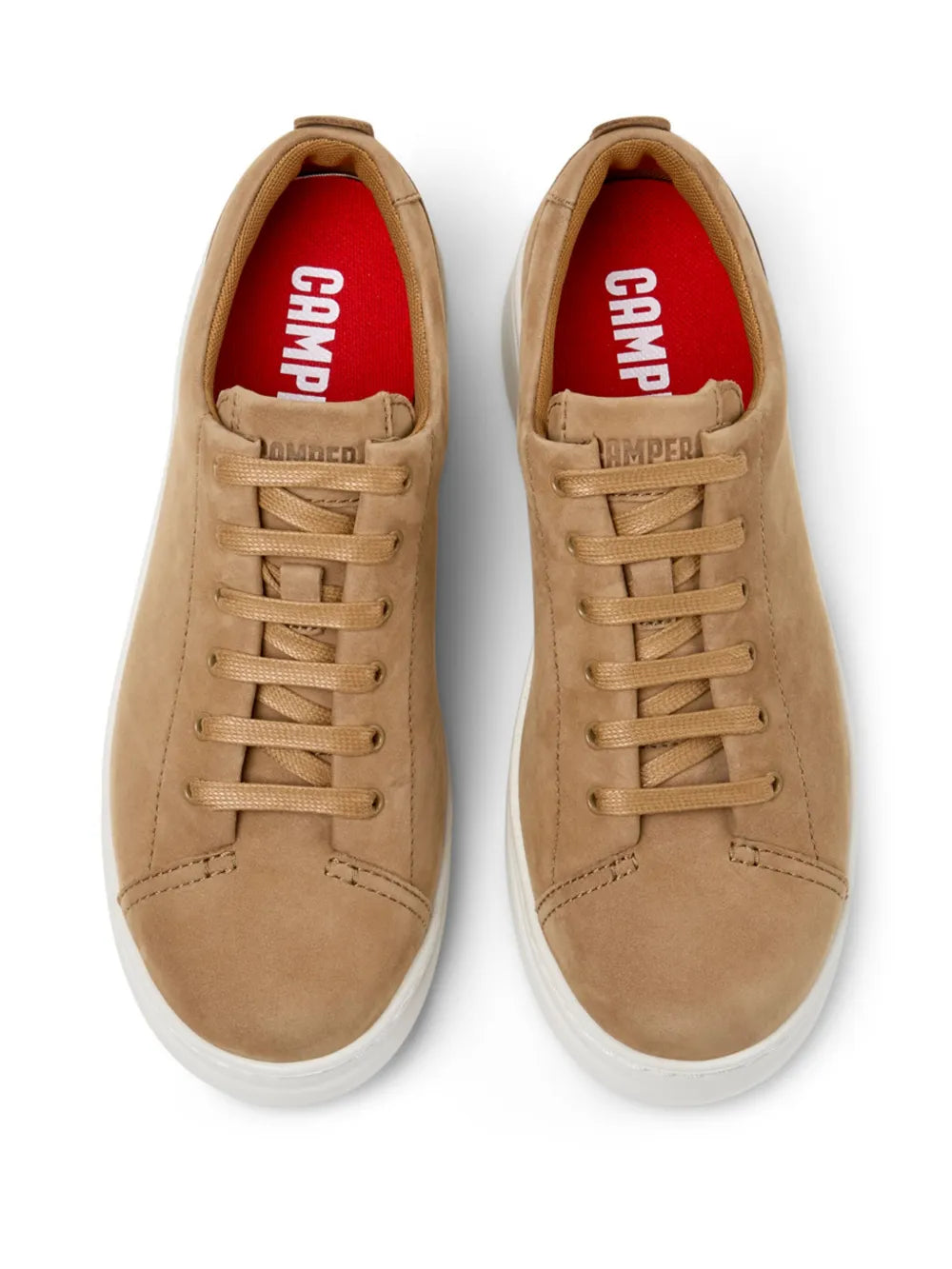 Beige lace-up sneakers with red logo label on tongue and white sole