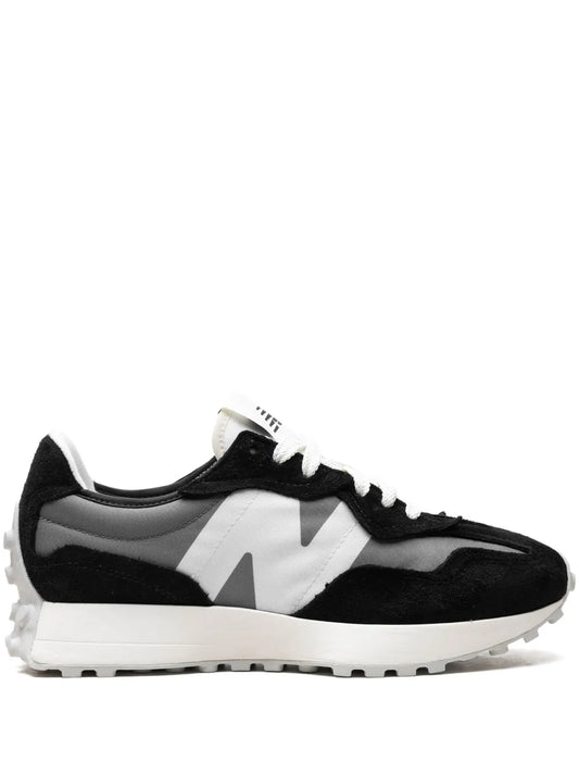 Black and white sneaker with lace-up front and chunky rubber sole