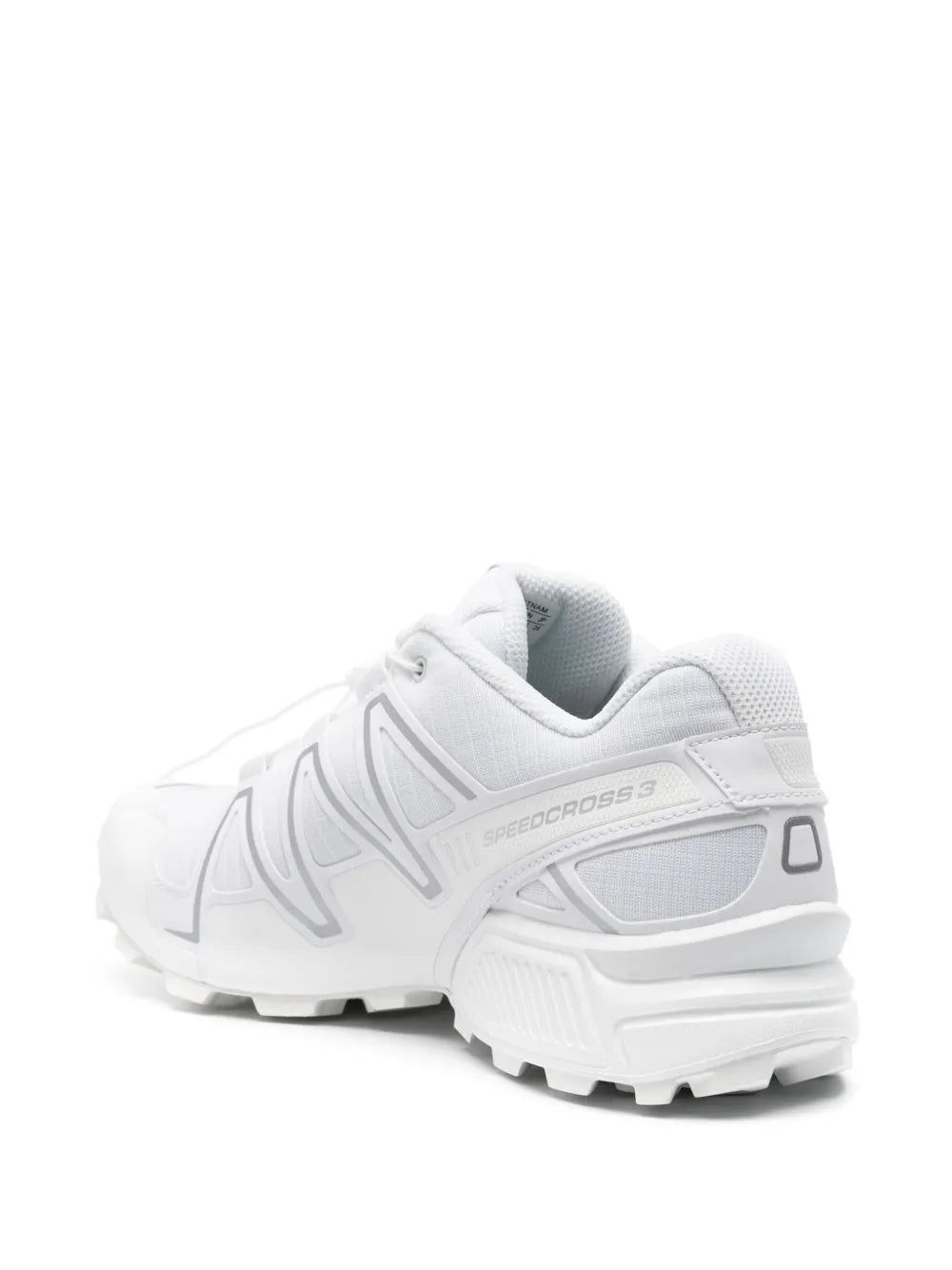 White lace-up trail shoe with molded side panel and chunky tread sole