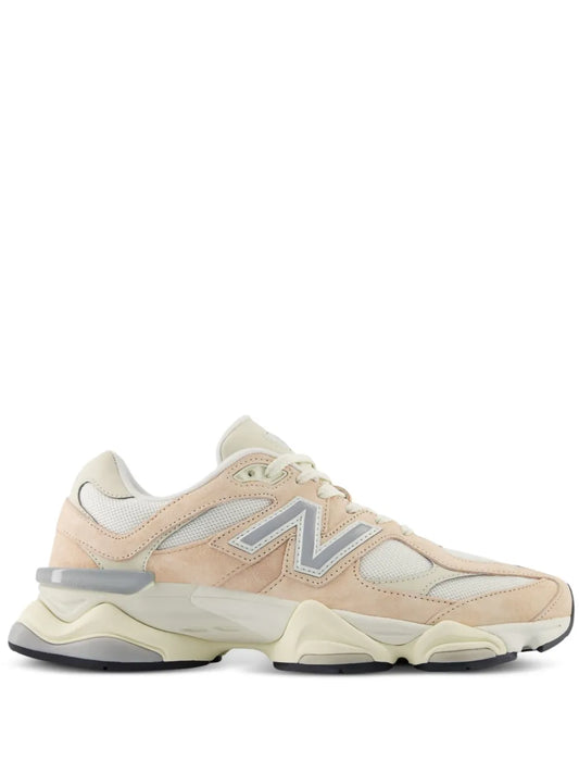 New Balance 9060 beige lace-up sneaker with blue N logo and chunky sole