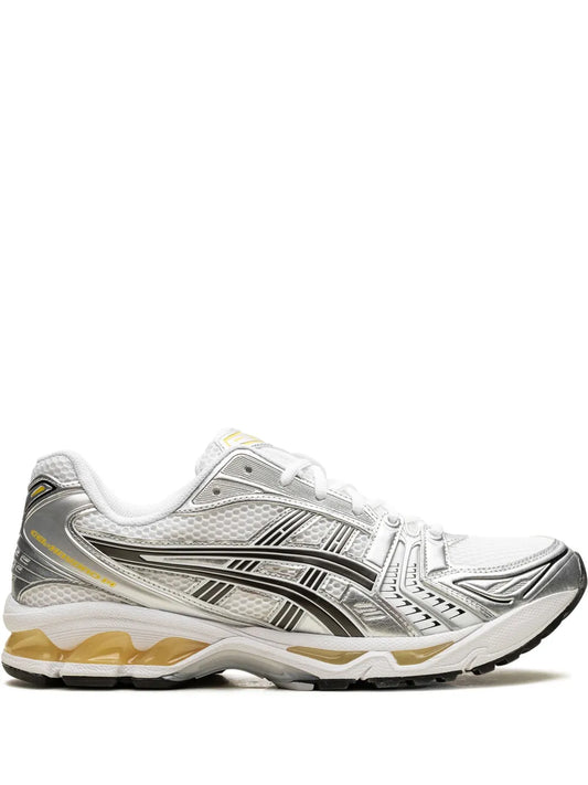 ASICS running shoe in white with black stripes, lace-up front and cushioned sole