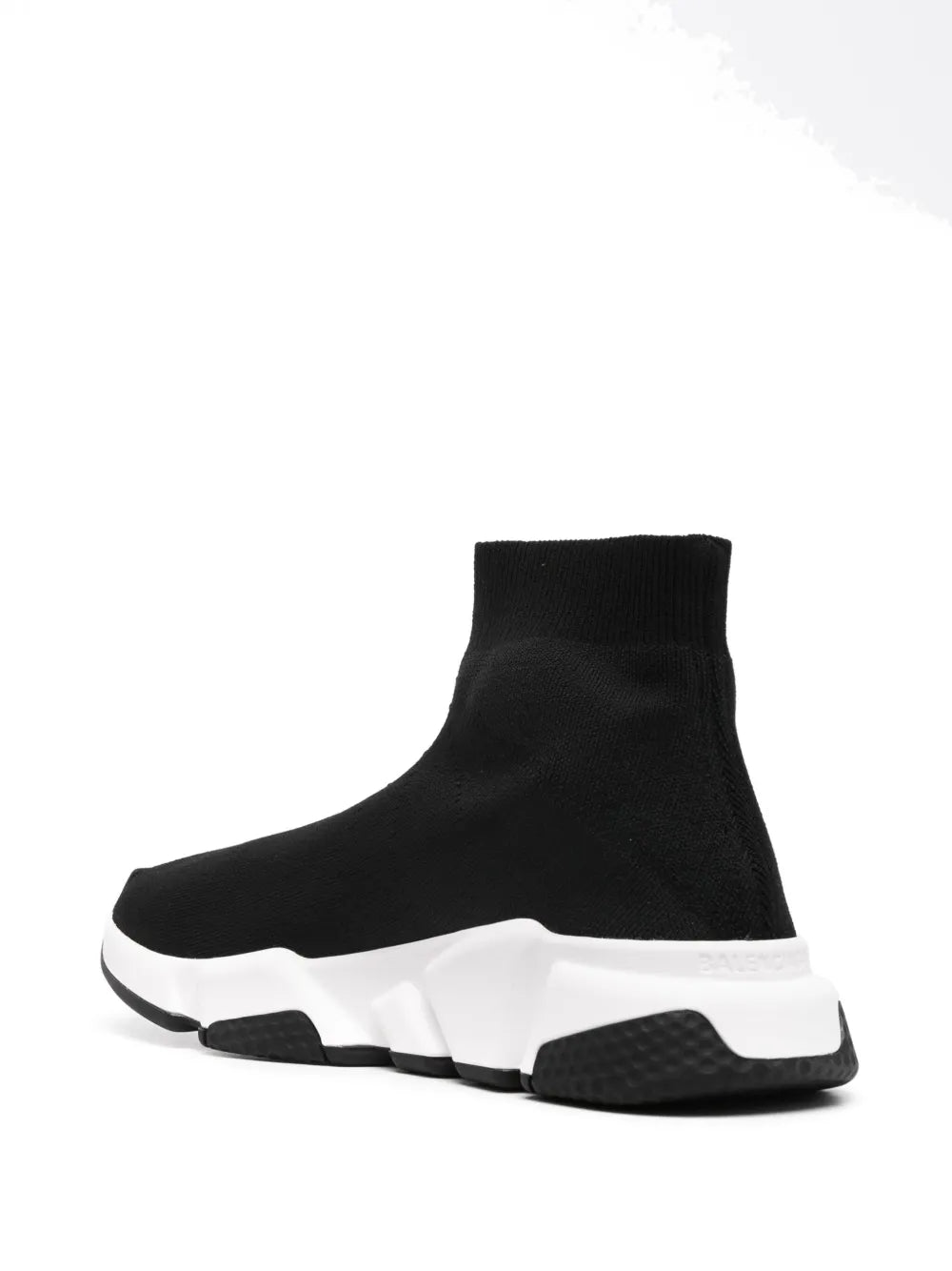 Black knit sock sneaker profile view with thick white midsole and black outsole