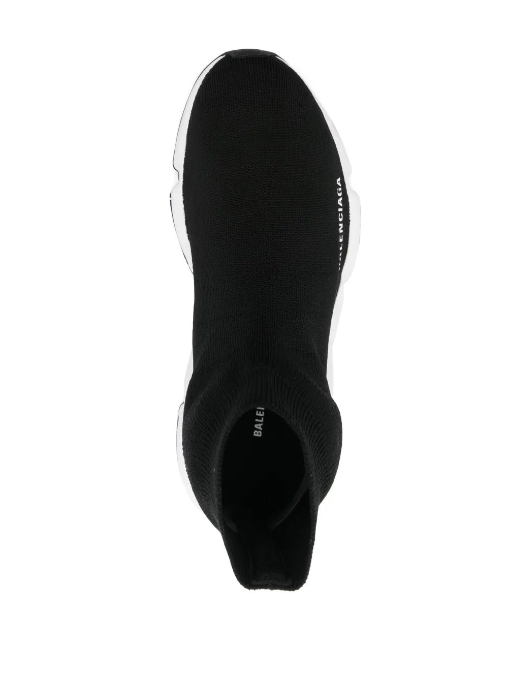 Black knit sock sneaker heel view with pull tab and BALENCIAGA branding, white trim