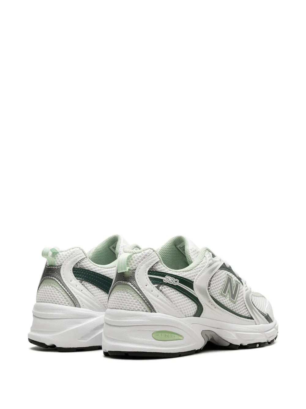 Pair of white and green lace-up sneakers, rear side view with N logo