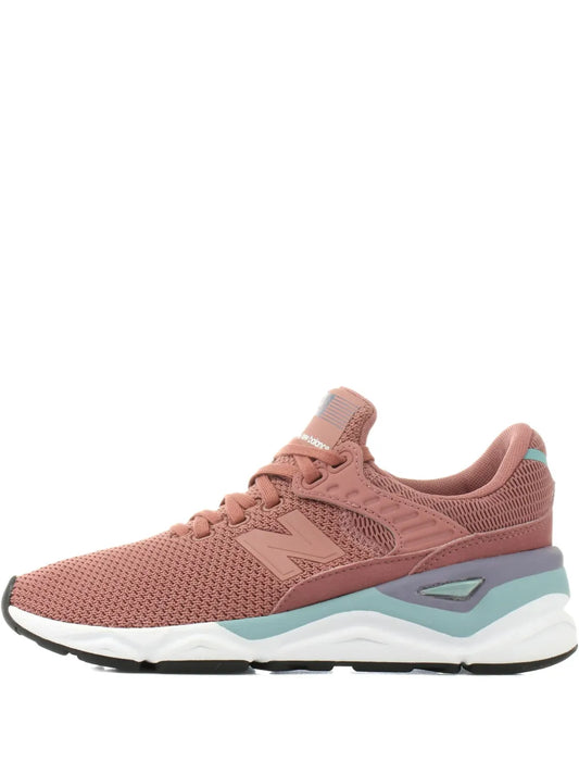 Brown lace-up running sneaker with mesh upper, New Balance branding, cushioned sole