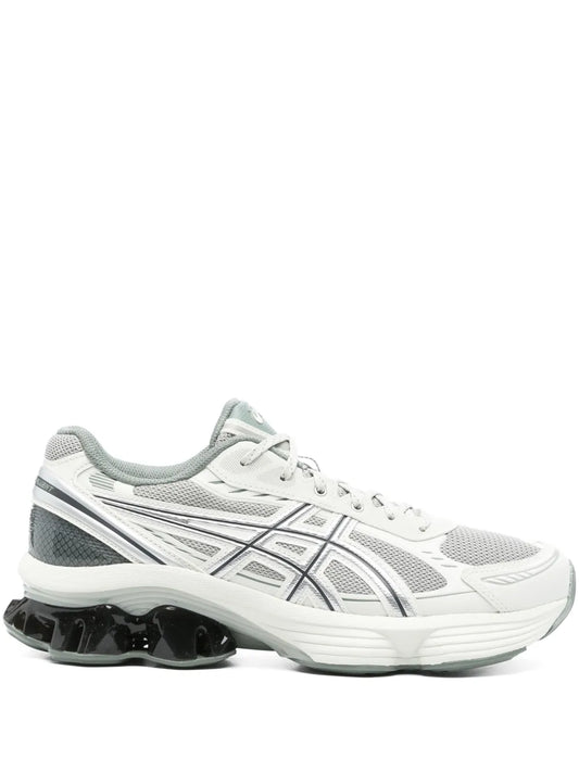 Grey/white lace-up running sneaker with GEL midsole and black tread pods