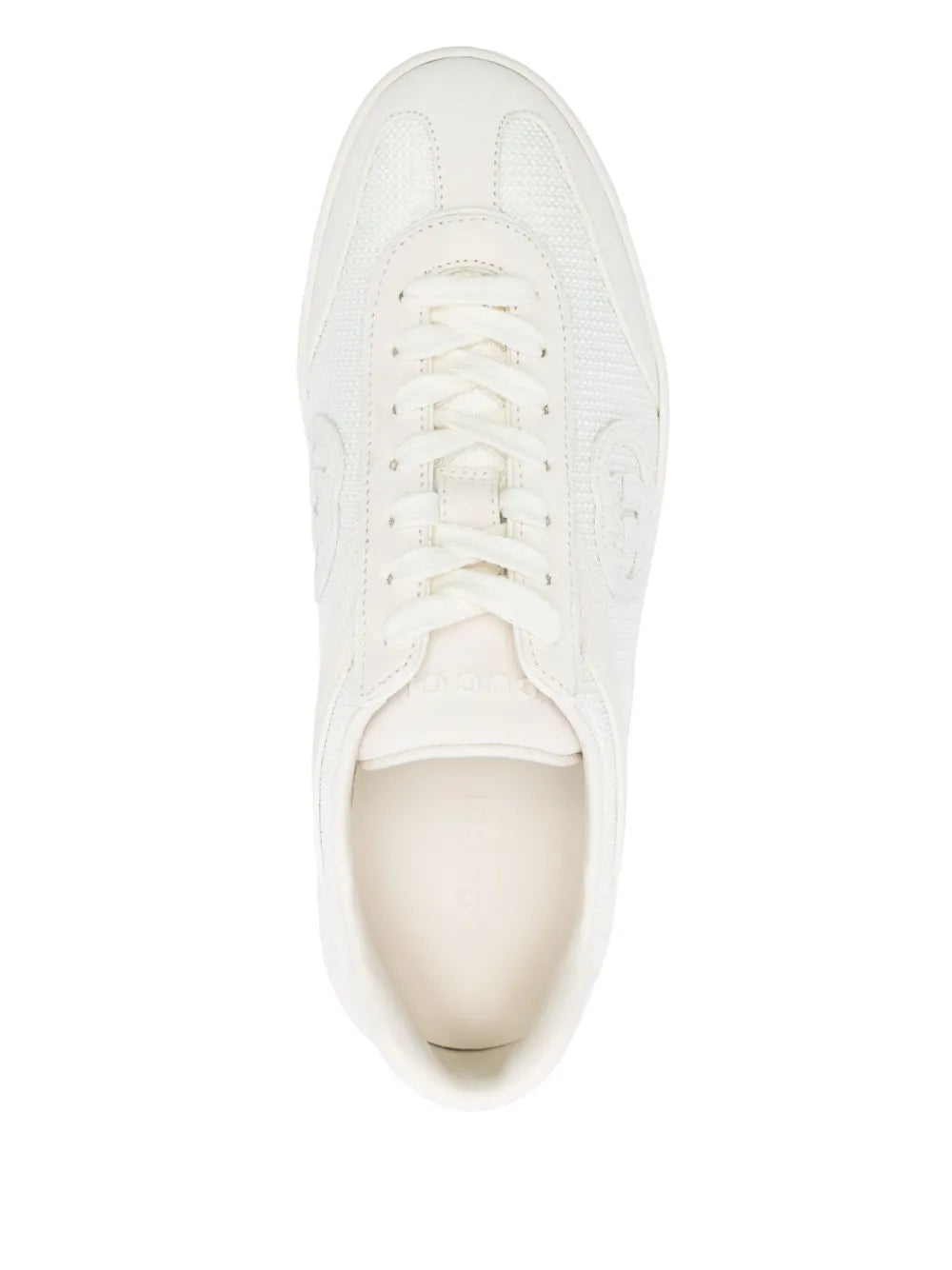 White low-top sneaker front view with lace-up and padded collar