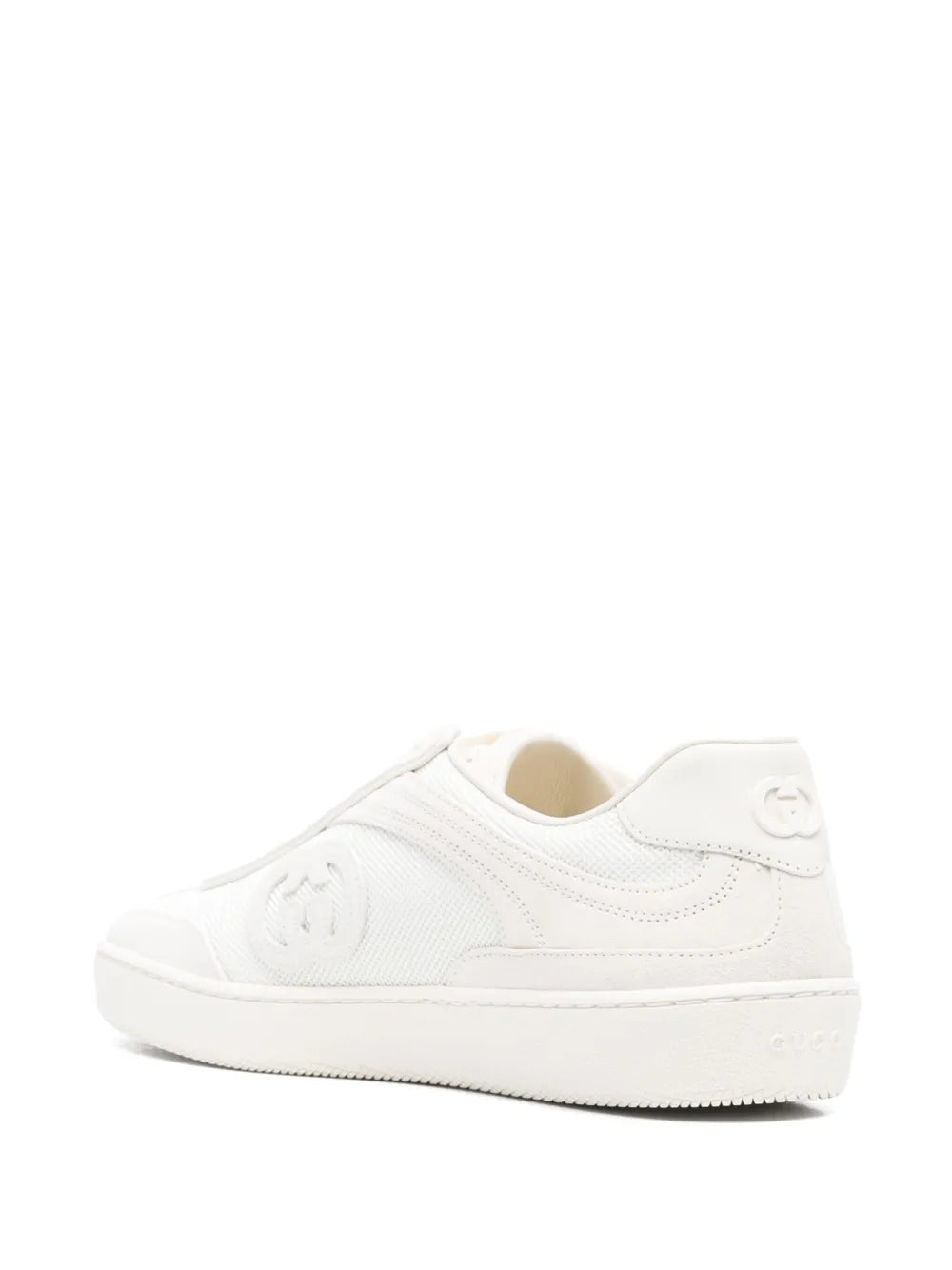 White low-top sneaker angled view with side logo and textured sole