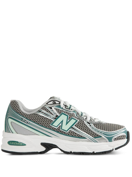 Grey New Balance 740 running shoes with teal accents and white laces