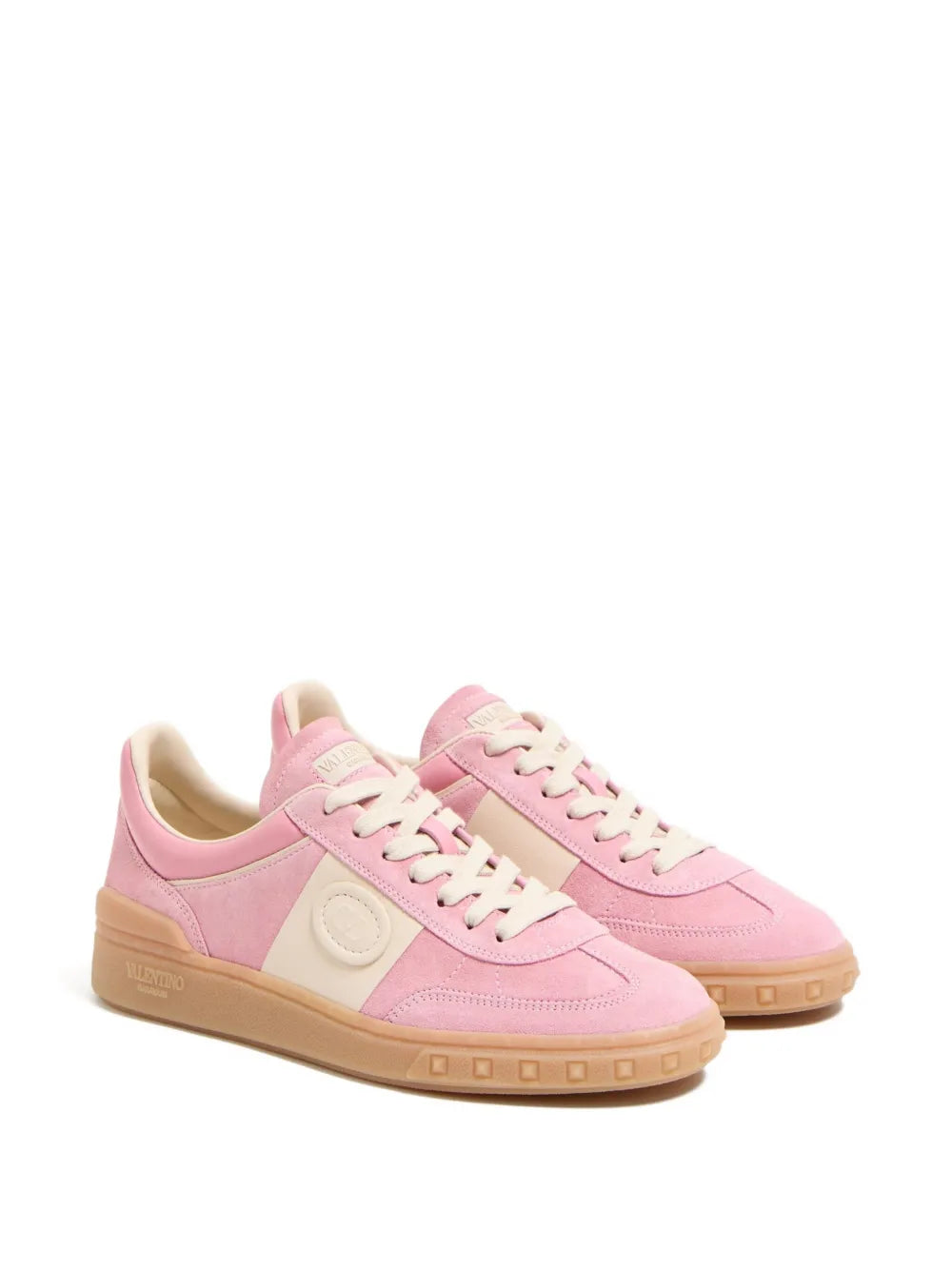 Pink lace-up sneakers with color-block panels and tan gum-style rubber sole