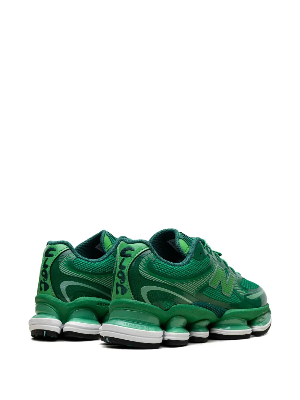 Green low-top sneakers with rear cushioning pods and lace-up upper