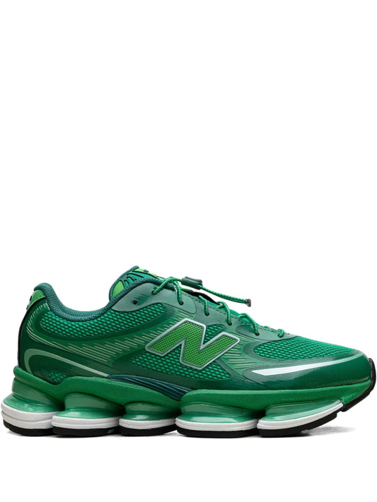Green New Balance low-top sneakers with N logo and lace-up design